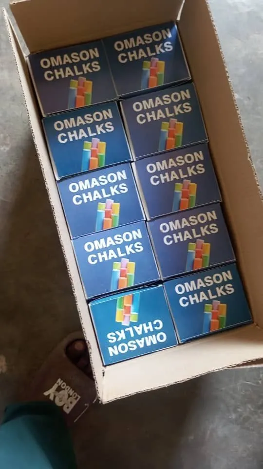 Omason chalk boxes being packed into a carton